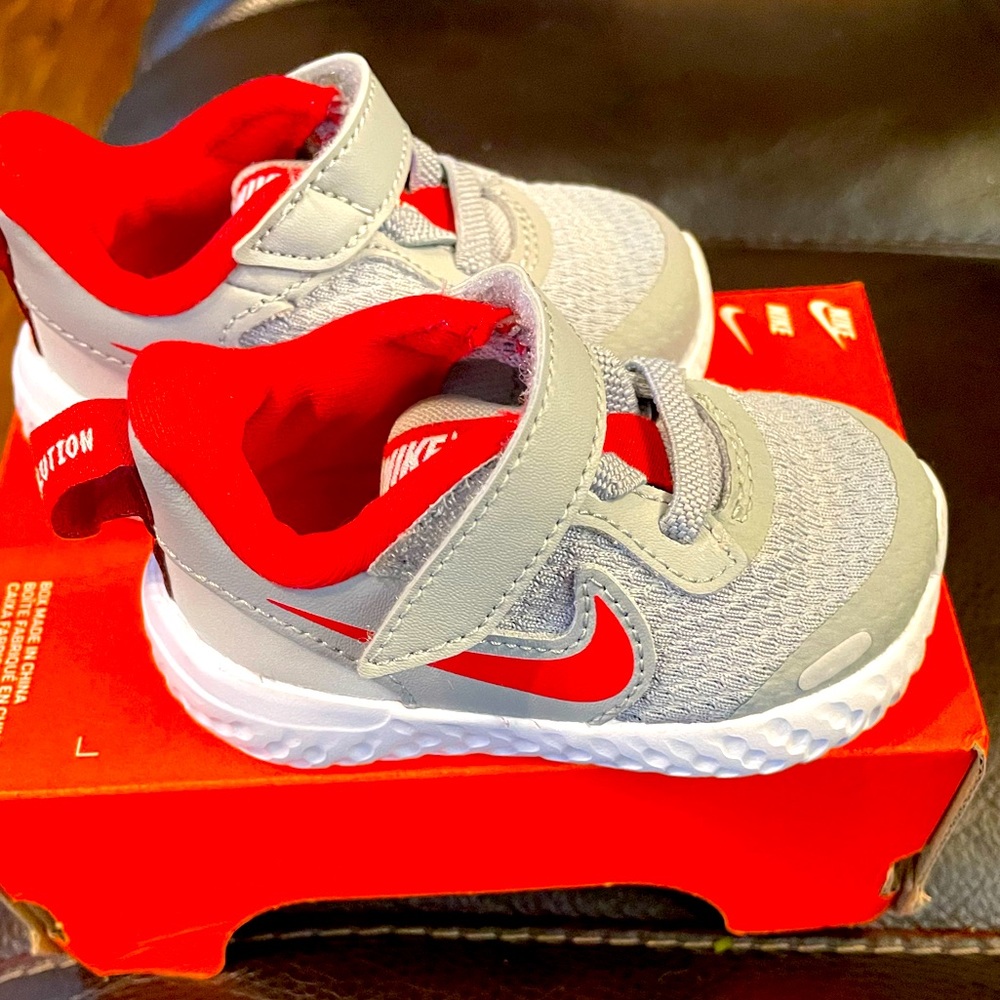 Grey w/red swoosh Nikes Great Condition